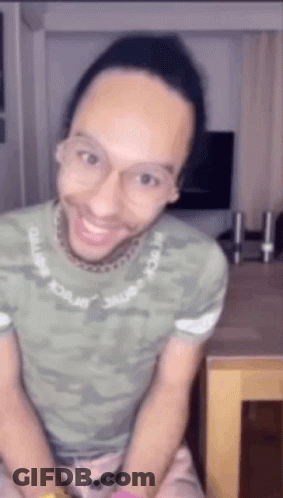 Man In Glasses And Green Shirt Smiling GIF