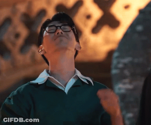 Man In Glasses And Green Sweater Looking Up GIF