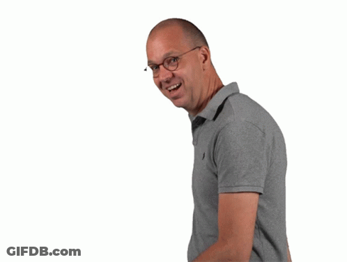 Man In Glasses And Grey Polo Making Heart Shape GIF