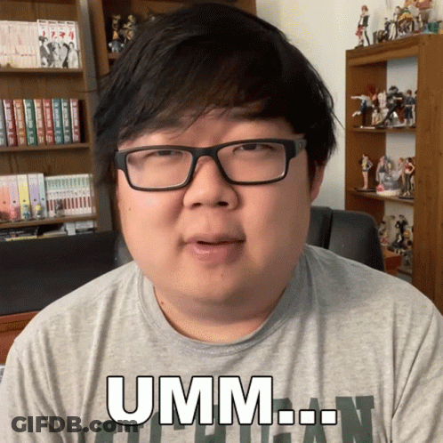 Man In Glasses And Grey Shirt Saying Umm GIF