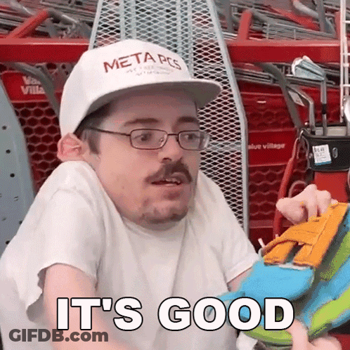 Man In Glasses And Hat Holding Toy Saying It's Good GIF