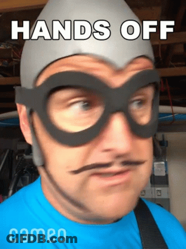 Man In Glasses And Hat Saying Hands Off GIF