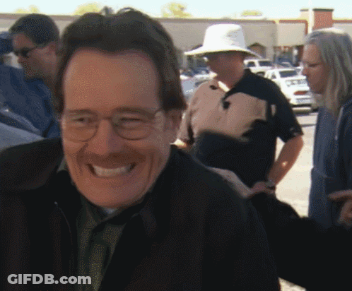 Man In Glasses And Hat Smiling At Group GIF