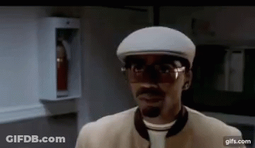 Man In Glasses And Hat Standing In Room GIF