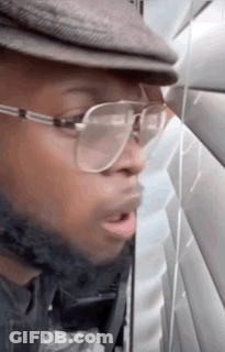 Man In Glasses And Hat Talking On Phone GIF