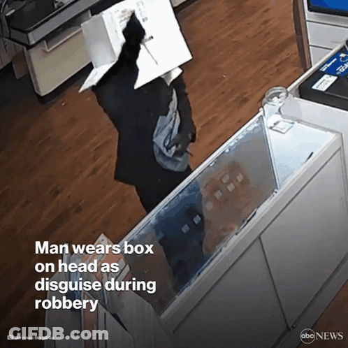 Man In Glasses And Hat With Another In Dark Room GIF