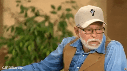 Man In Glasses And Hat With Cross GIF