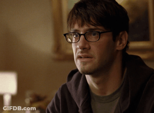 Man In Glasses And Hoodie Looking GIF