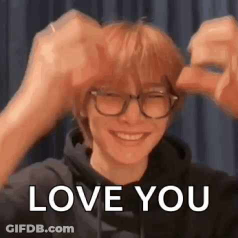 Man In Glasses And Hoodie Making Heart With Hands GIF