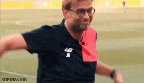 Man In Glasses And New Balance Shirt Smiling GIF