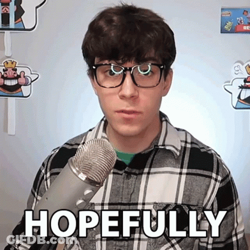 Man In Glasses And Plaid Shirt Holding Microphone Saying Hopefully GIF