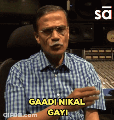 Man In Glasses And Plaid Shirt Says Gaadi Nikal Gayi GIF