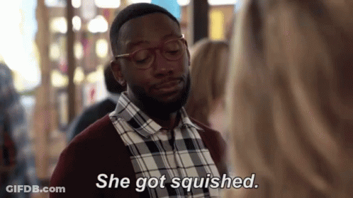 Man In Glasses And Plaid Shirt Talking To Woman Saying She Got Squished GIF