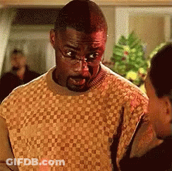 Man In Glasses And Plaid Sweater Talking To Woman GIF