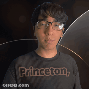 Man In Glasses And Princeton Shirt Looking At Camera GIF