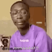 Man In Glasses And Purple Shirt Making A Face GIF