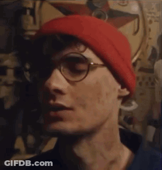 Man In Glasses And Red Beanie Saying Been Thinking About You GIF