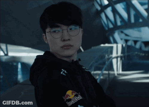 Man In Glasses And Red Bull Jacket Looking At Camera GIF
