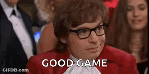 Man In Glasses And Red Jacket Saying Good Game In Crowd GIF
