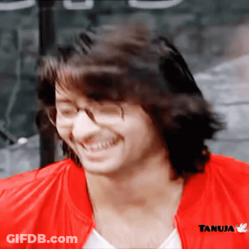 Man In Glasses And Red Jacket With Tanuja GIF