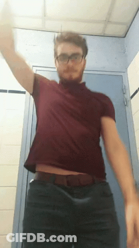 Man In Glasses And Red Shirt In Bathroom GIF