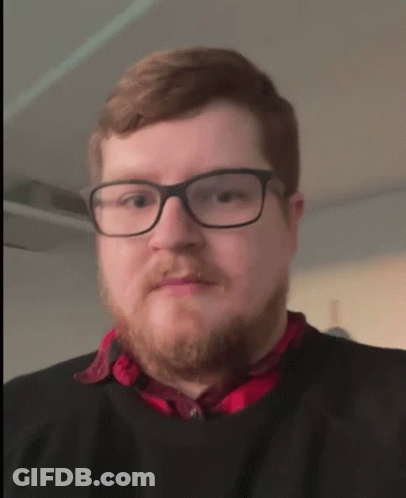 Man In Glasses And Red Shirt Processing GIF