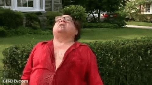 Man In Glasses And Red Shirt Standing In Yard GIF