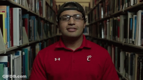 Man In Glasses And Red Shirt With Letter C GIF
