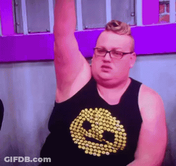 Man In Glasses And Smiley Tank Top Holding Arm Up GIF