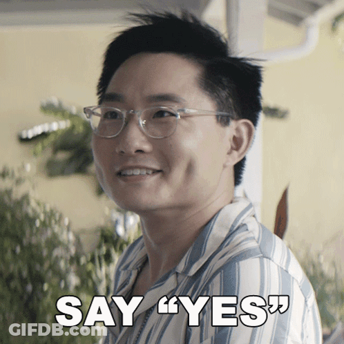 Man In Glasses And Striped Shirt Say Yes GIF