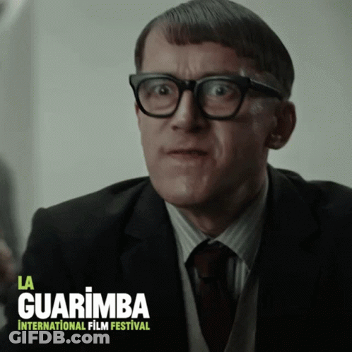 Man In Glasses And Suit La Guarimba International Film Festival Poster GIF