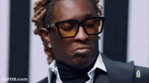 Man In Glasses And Suit Making Funny Face GIF