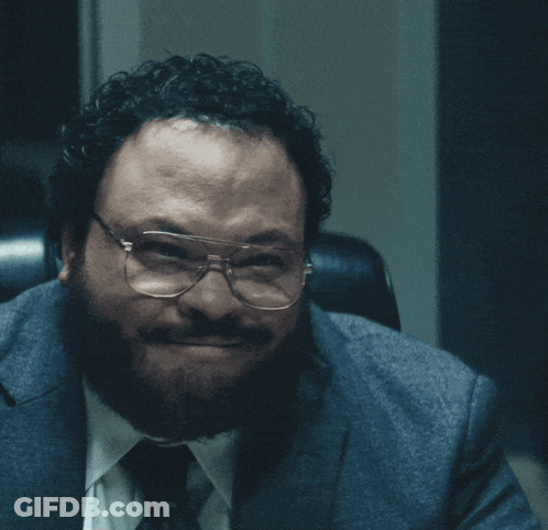 Man In Glasses And Suit Saying Semi-Gloss GIF