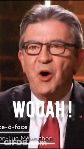 Man In Glasses And Suit Saying Wooah GIF