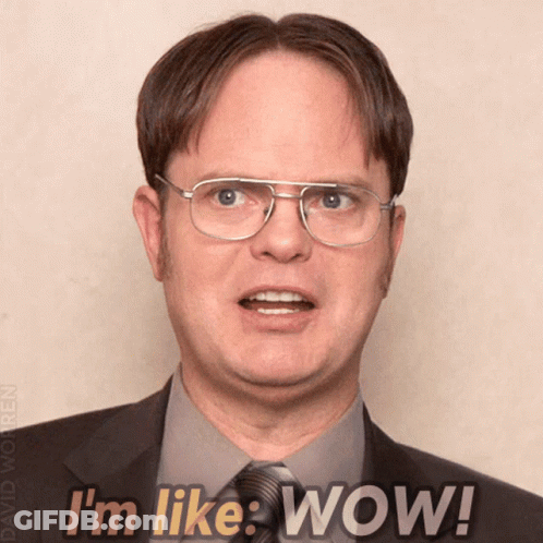 Man In Glasses And Suit Saying Wow GIF