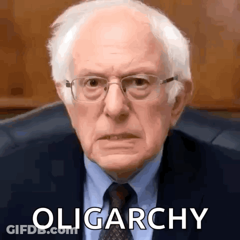 Man In Glasses And Suit Sitting With Oligarchy GIF