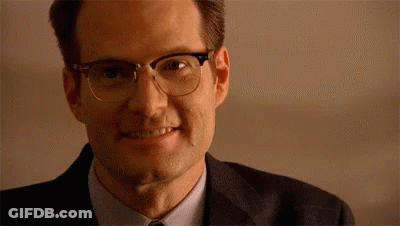 Man In Glasses And Suit Smiling GIF