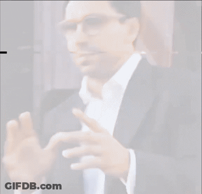 Man In Glasses And Suit With Hands Outstretched GIF