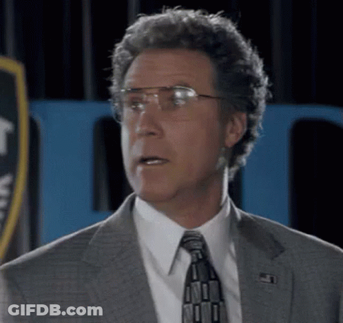 Man In Glasses And Suit With Police Badge GIF