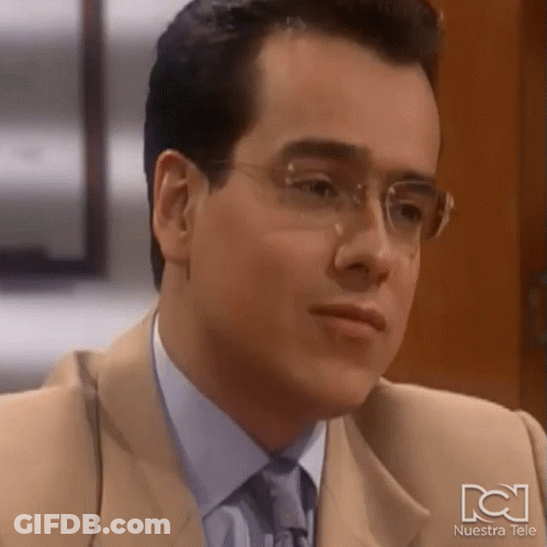 Man In Glasses And Tan Suit Nuestra Tele GIF