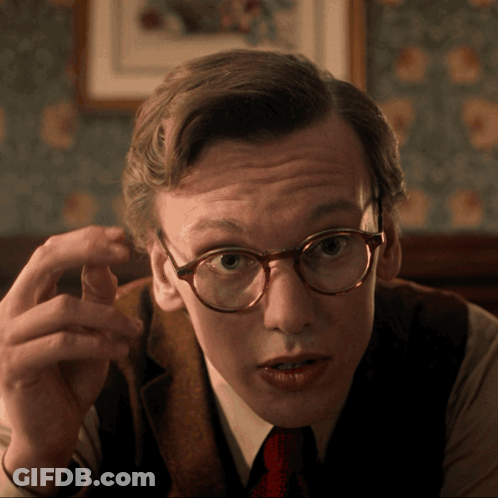 Man In Glasses And Vest Pointing GIF
