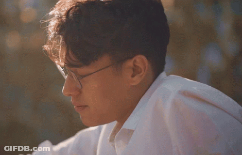 Man In Glasses And White Shirt Looking Aside GIF
