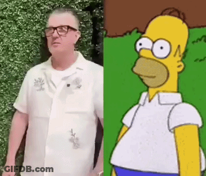 Man In Glasses And White Shirt Next To Homer Simpson GIF