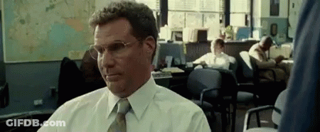 Man In Glasses And White Shirt Sitting In Office GIF