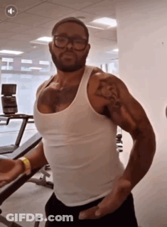 Man In Glasses And White Tank Top In Gym GIF