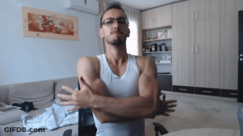 Man In Glasses And White Tank Top With Arms Crossed GIF