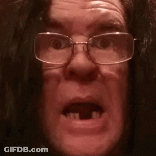 Man In Glasses And Wig Making Funny Face GIF