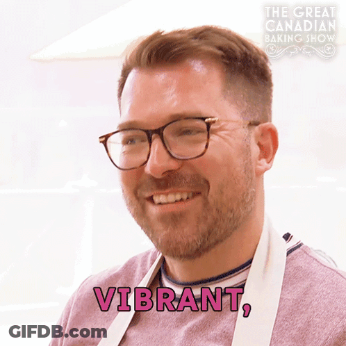Man In Glasses Apron Says Vibrant In Pink GIF