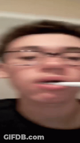 Man In Glasses Brushing Teeth GIF
