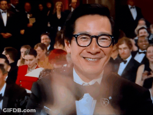 Man In Glasses Clapping Before Crowd GIF